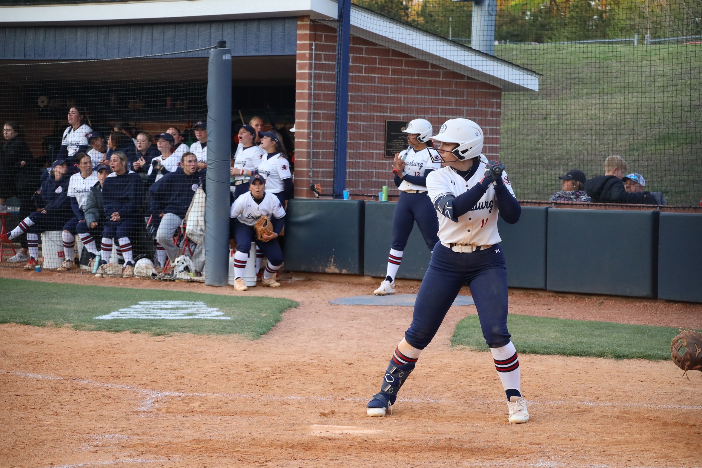 Louisburg Batter at the plate waits for her pitch.