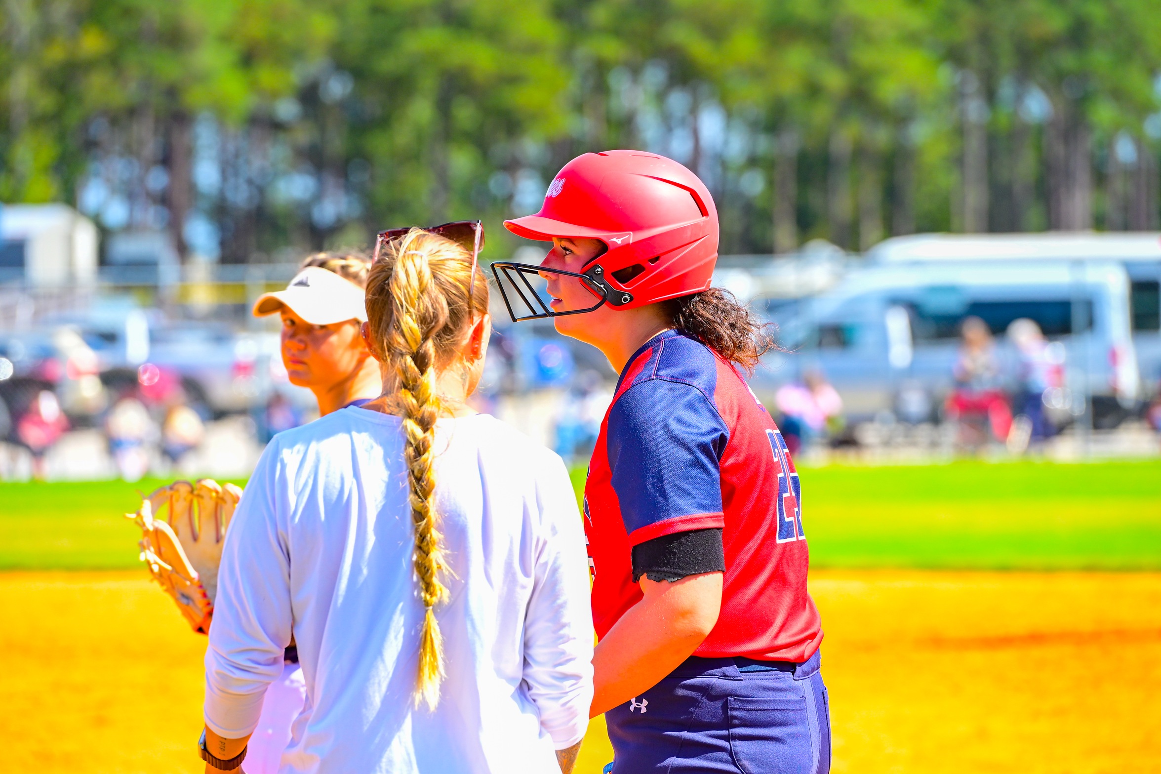 Bailey Radford on base talking with Coach